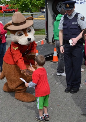 Safety Bear greeting a youth 