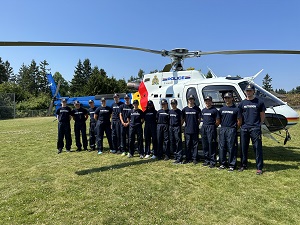 Youths in front of RCMP helicopter